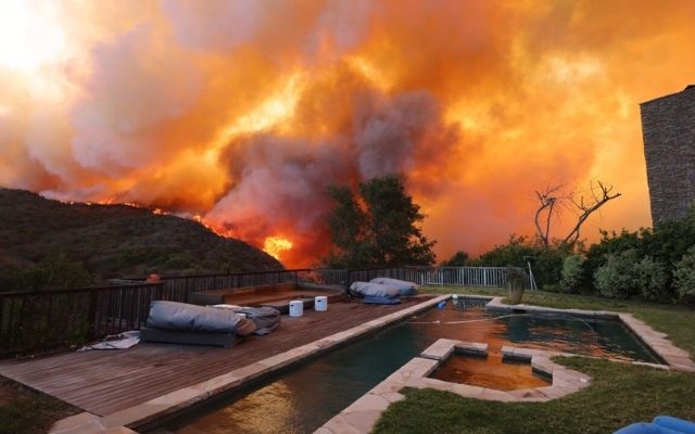 Wildfires Flare in LA, Forcing Many to Evacuate Their Homes