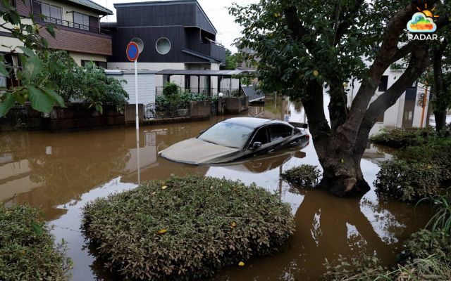 A car submerged in floodwaters due to Typhoon Dujuan