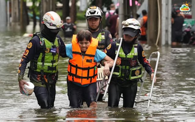 Crews rescue a resident from flooding area